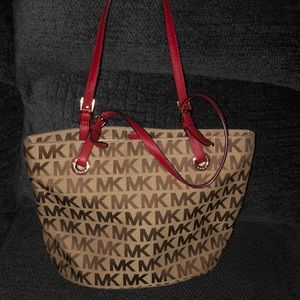 Micheal khors bag with red straps